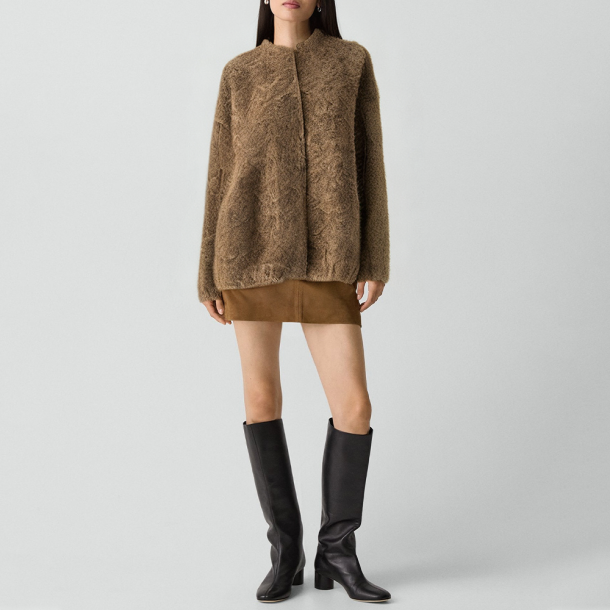 Round-neck jacket with raw edge finish